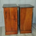 a pair of antique french walnut bedside cabinets
