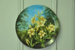 a beautiful vintage hand painted plate with lillies