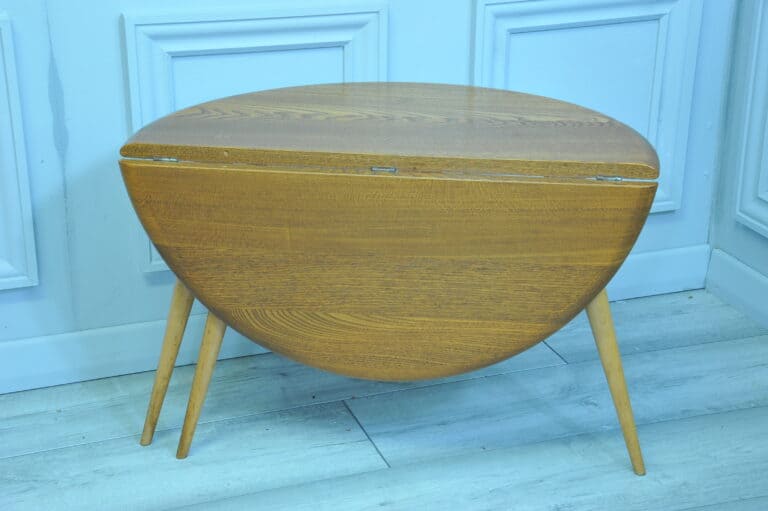 a vintage ercol round single drop leaf occasional table