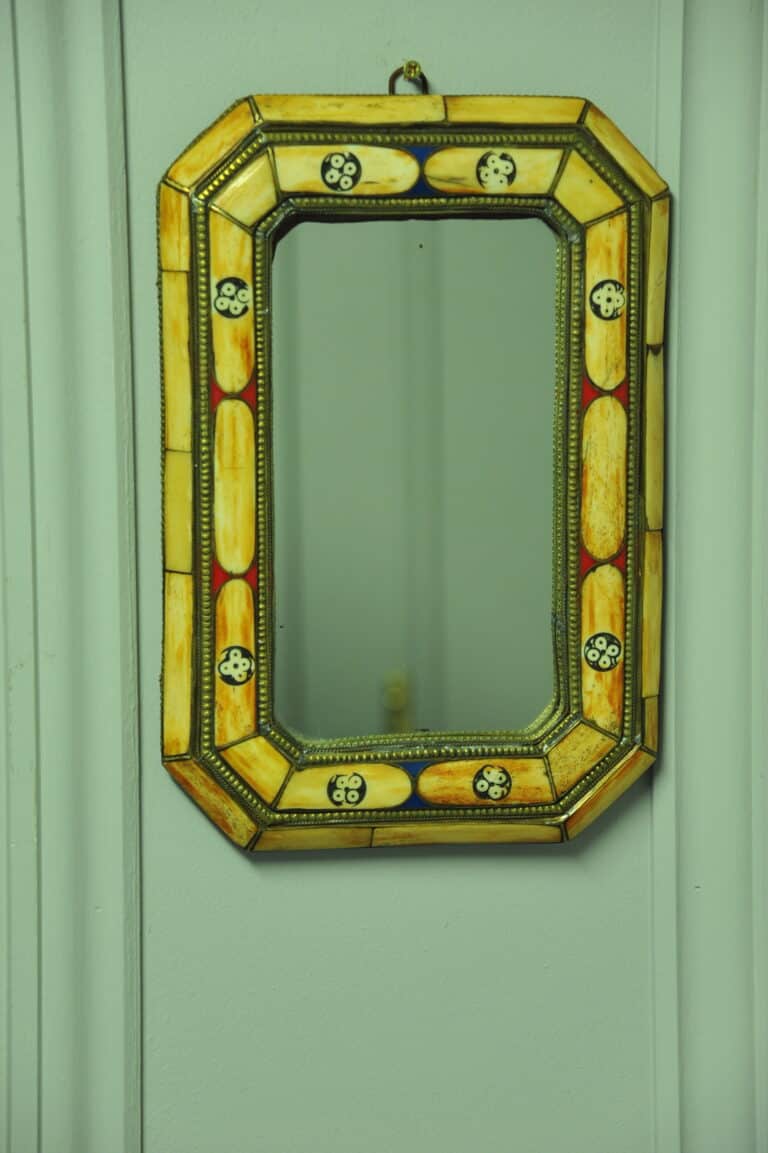 a vintage moroccan bone and brass decorated wall mirror