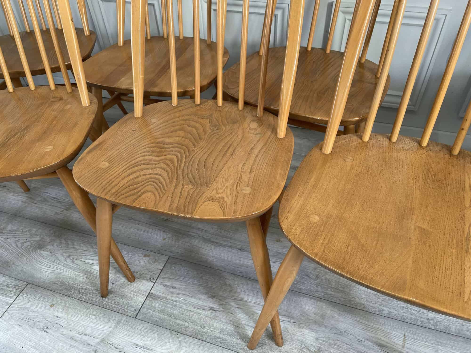 set of eight vintage ercol quaker dining chairs including two swan back carvers
