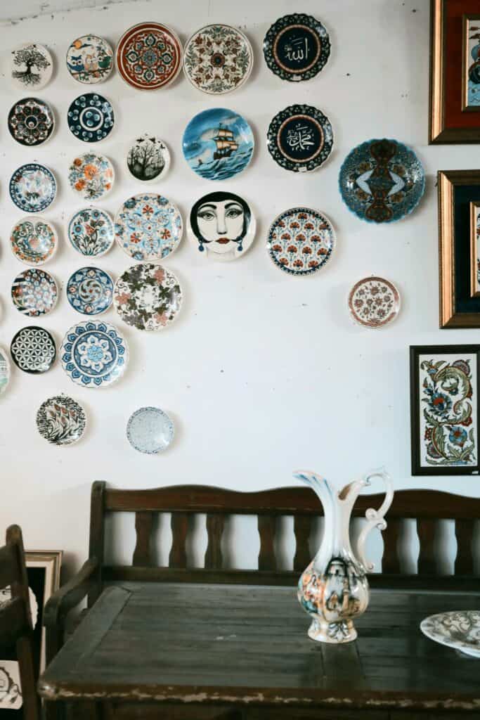 An image of ceramic antiques hung on a white wall.